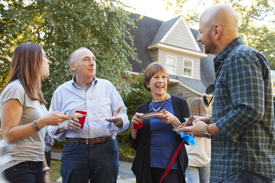 Neighbors eat together otuside