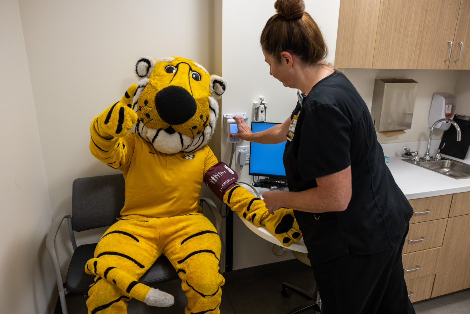 Truman with health care worker