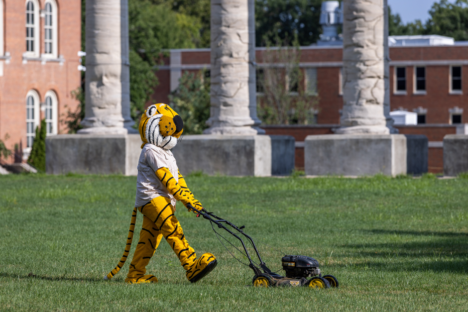 Truman with mower on Quad