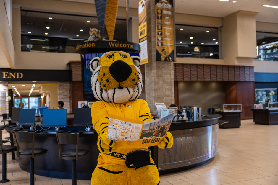 Truman holds brochure