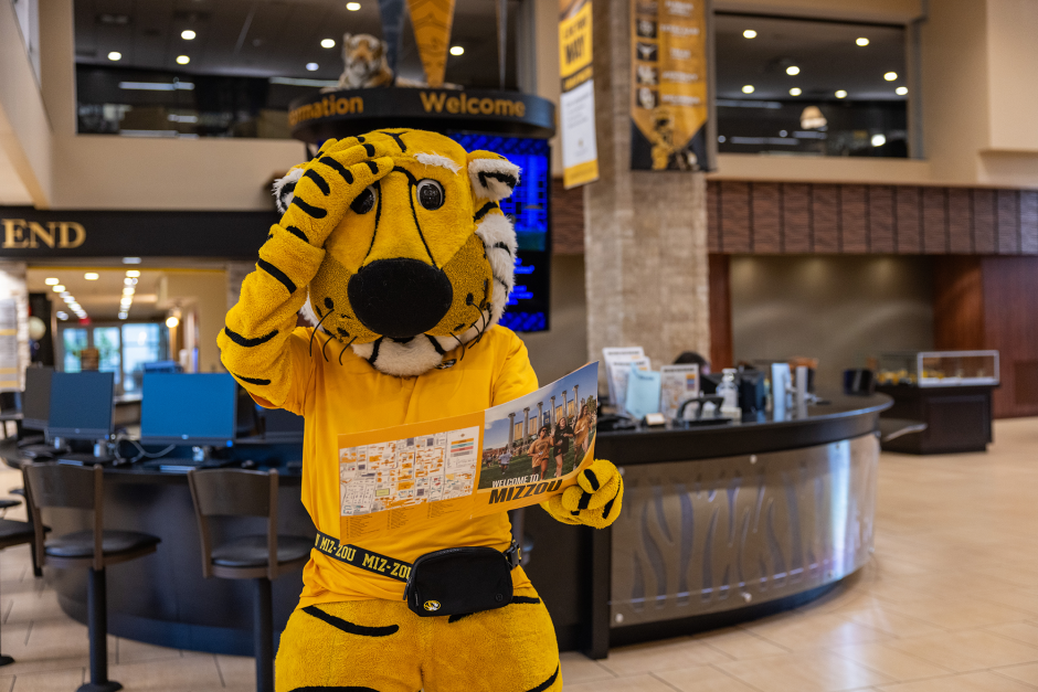 Student looks at campus map