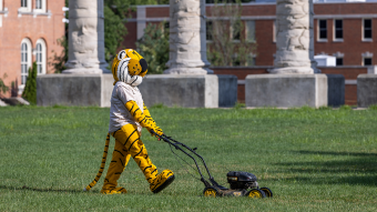 Truman mows the grass on the Quad