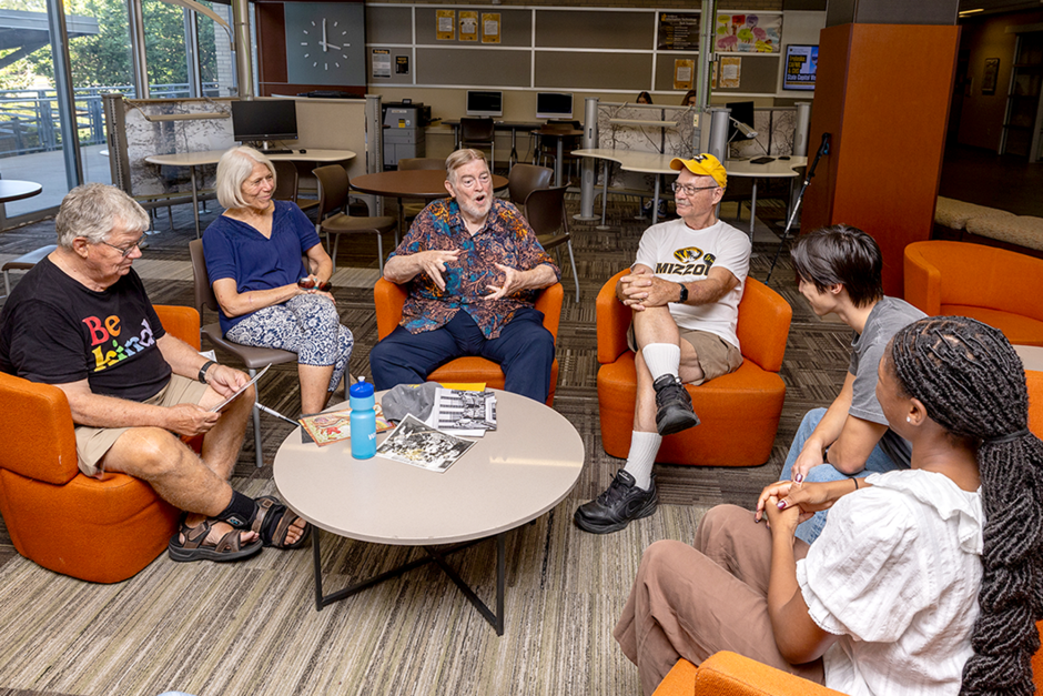 Alumni sit around table