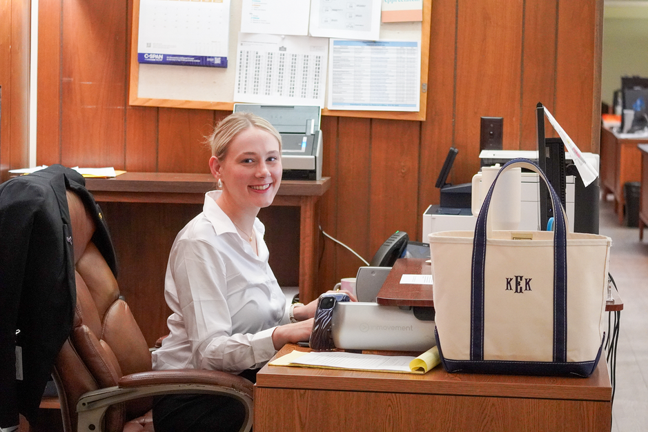 Kinsey Evans works at her desk