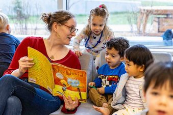 Teacher reads book to toddlers