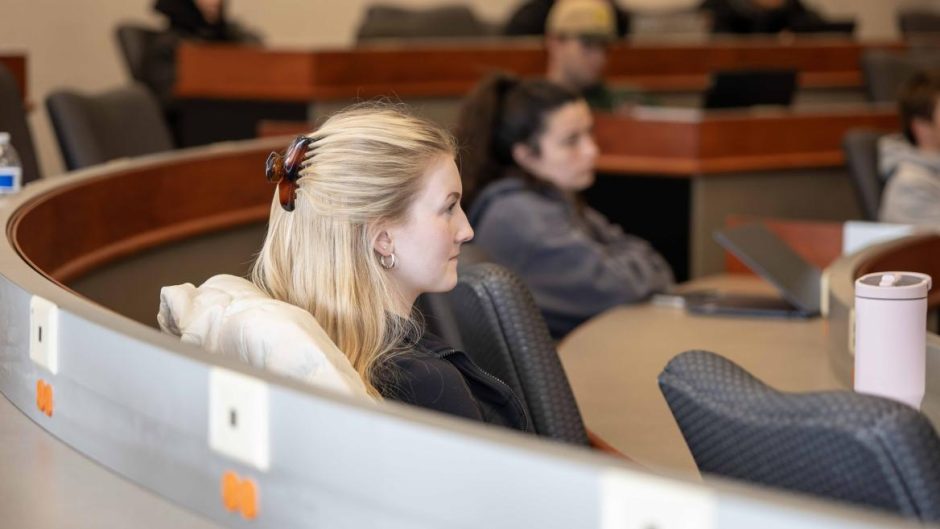 Side profile of student sitting in class.