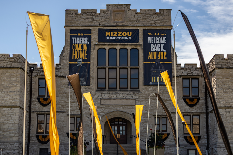 Homecoming signs hang from building