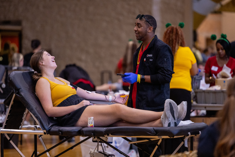 Student laughs while giving blood