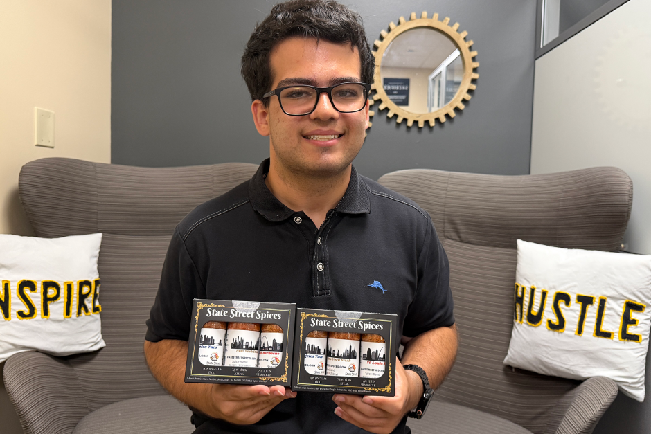 A student posing in his incubator space.