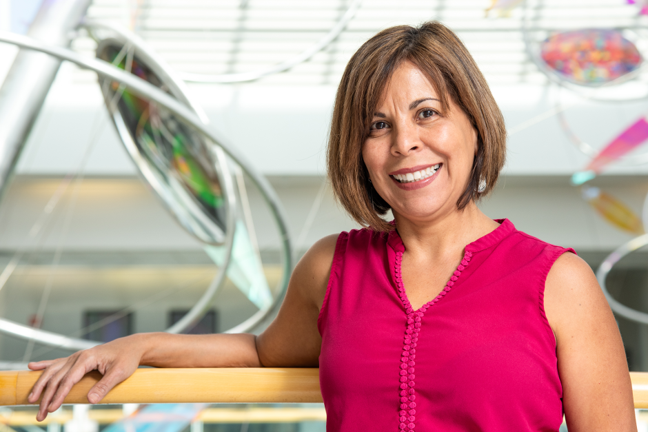 A researcher posing in the Bond Life Sciences Center