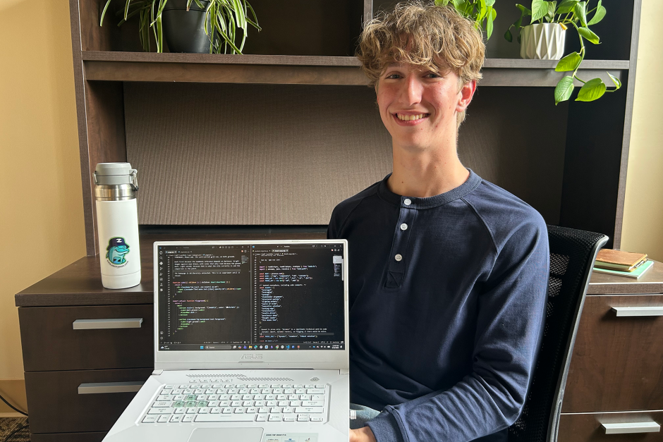 A student posing in his incubator space.