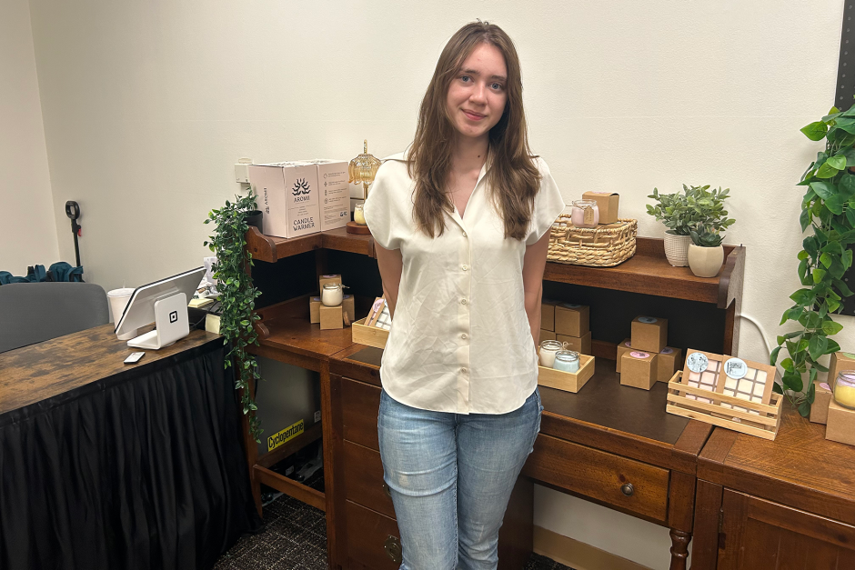 A student posing in her shop.