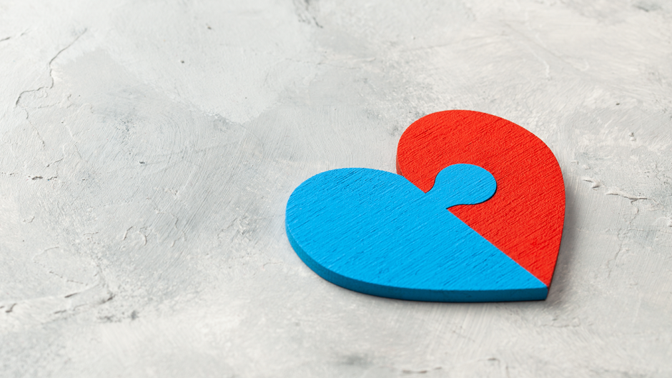 A heart that is half blue and half red.