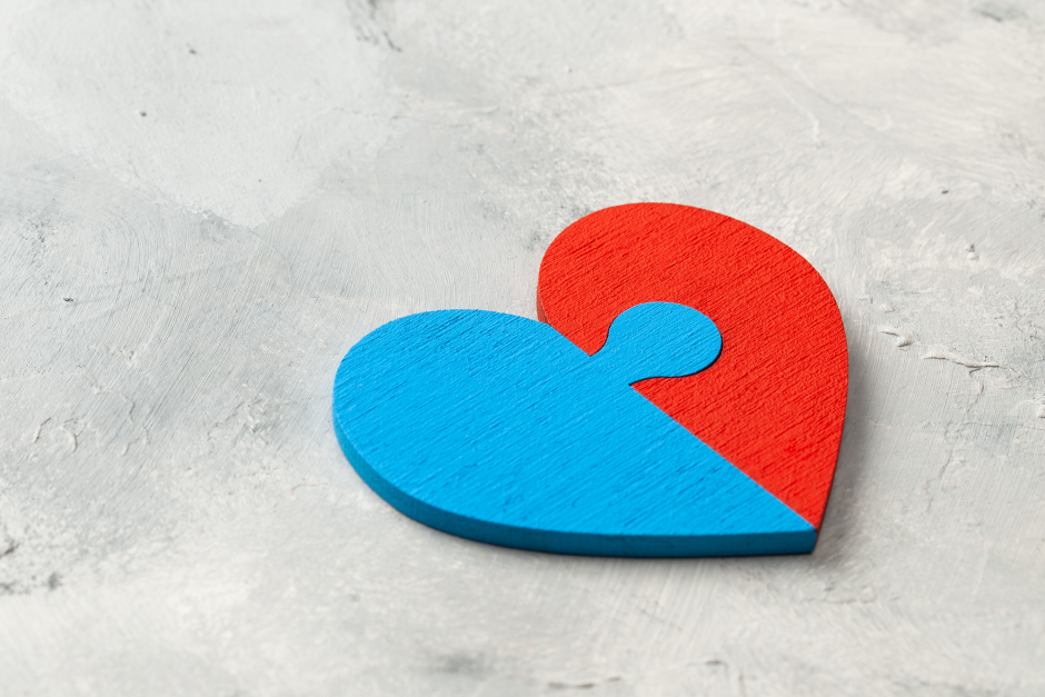 A heart that is half blue and half red.