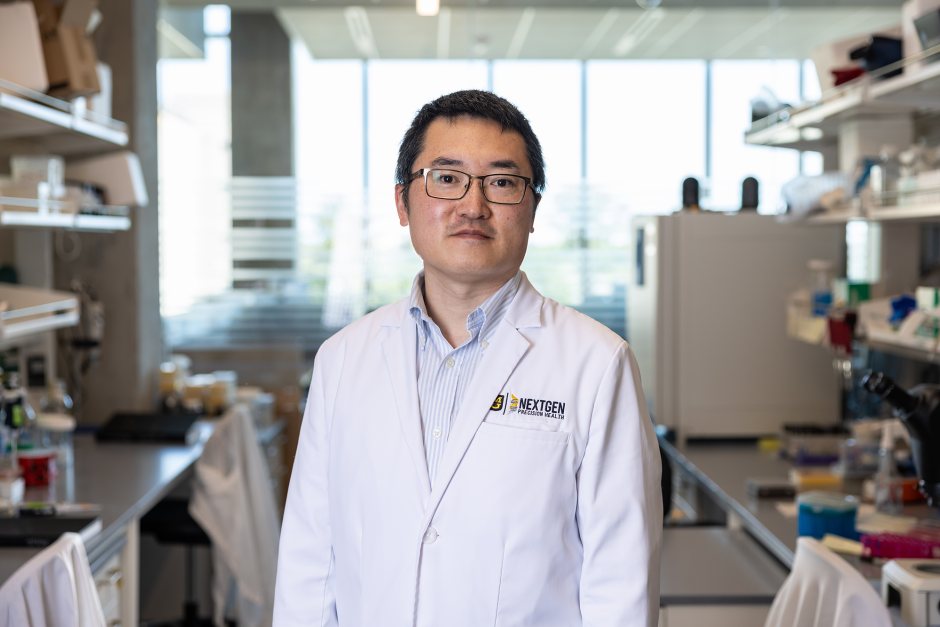 A researcher posing in the NextGen building.