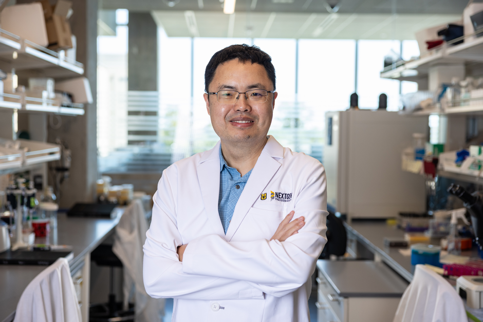 A researcher posing in the NextGen building.