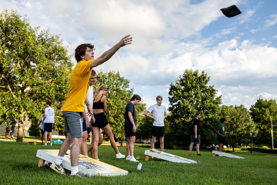Student tossing a bean bag