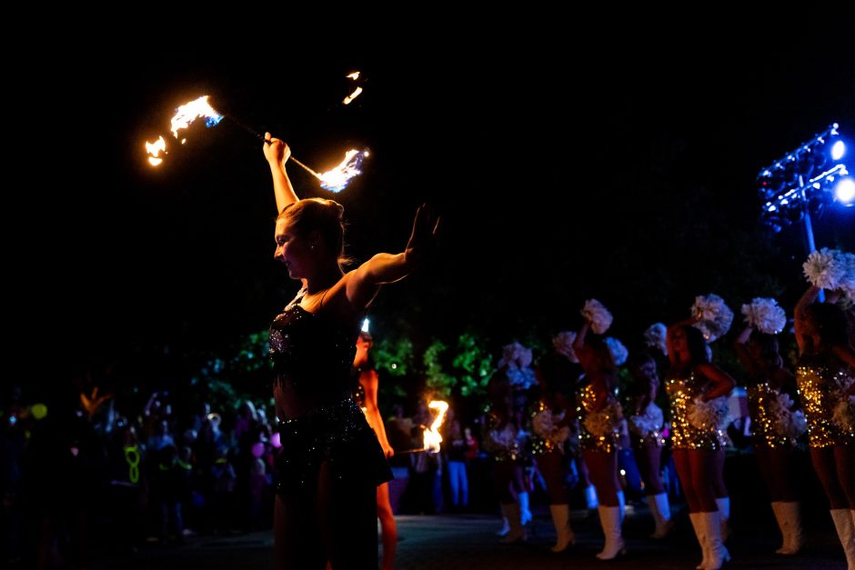 A fire-twirler performing at night