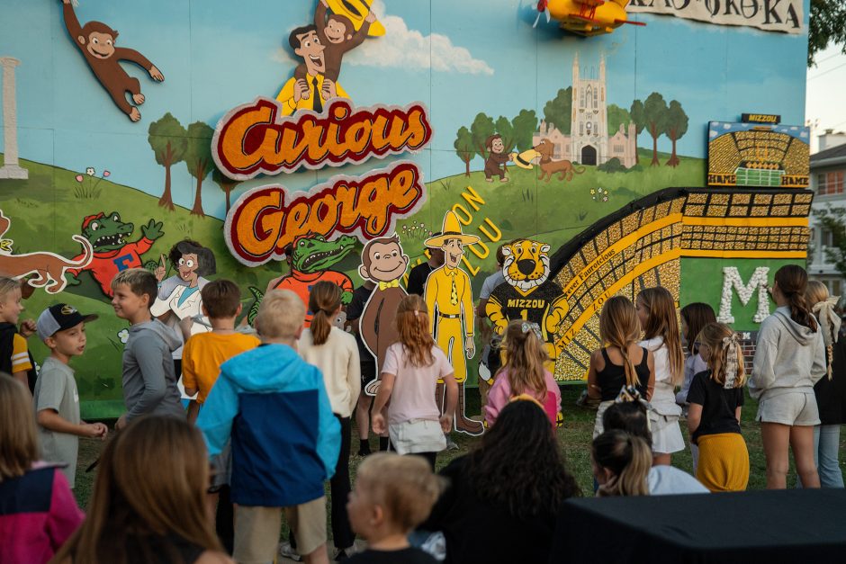 Children in front of campus decorations