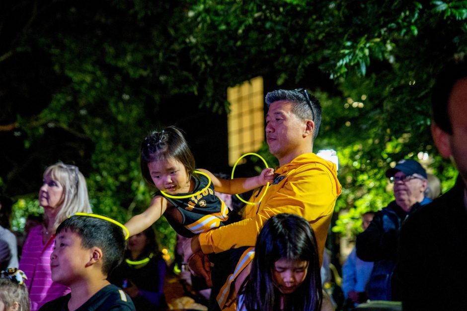 A child being held by an adult
