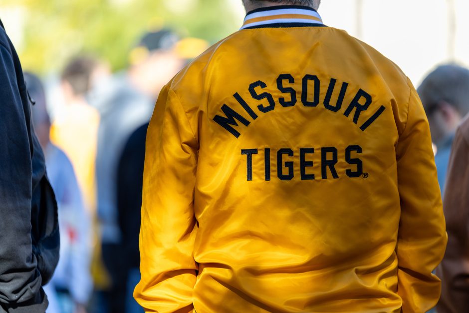 Back of a gold jacket that says "Missouri Tigers"