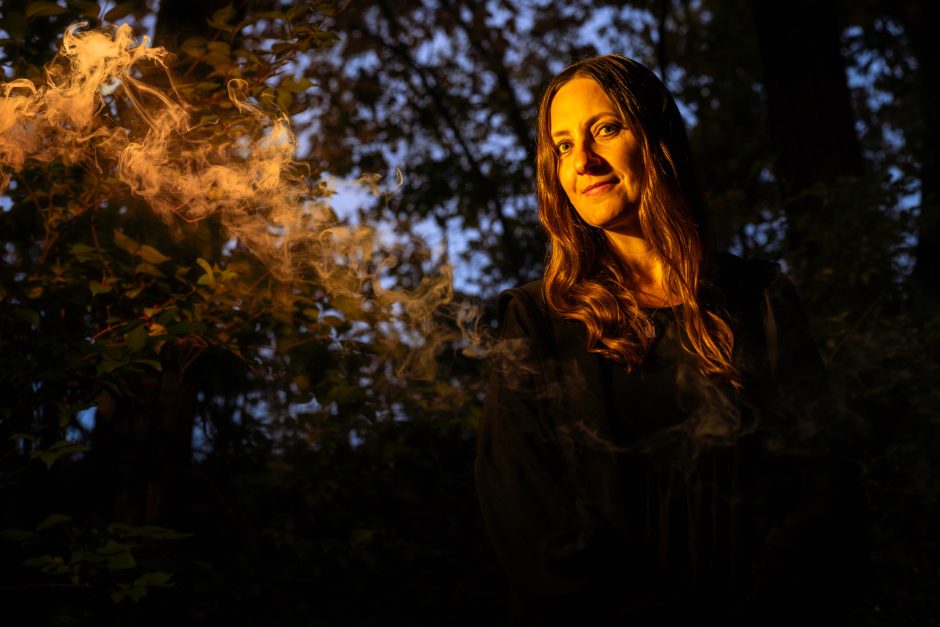 Woman in a dark spooky forest