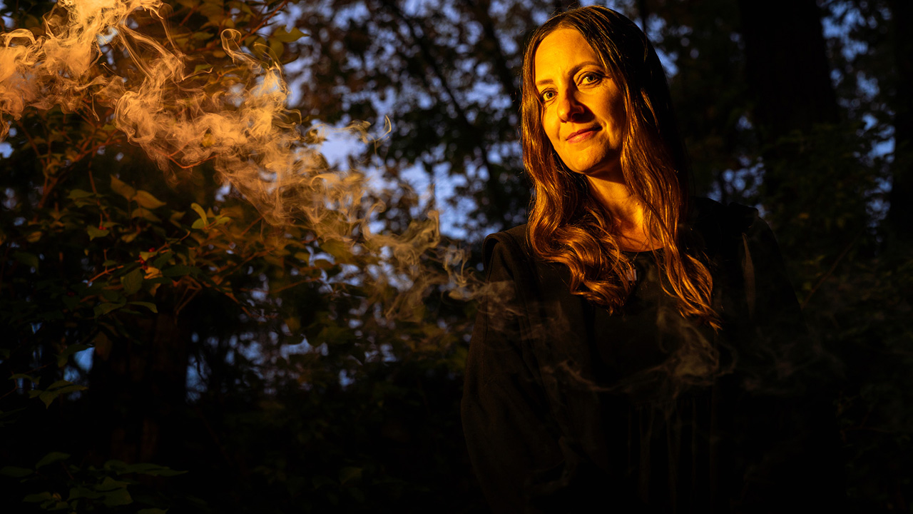 Woman in a dark spooky forest