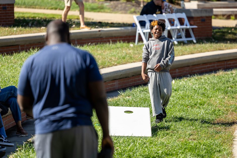 Two people playing yard game