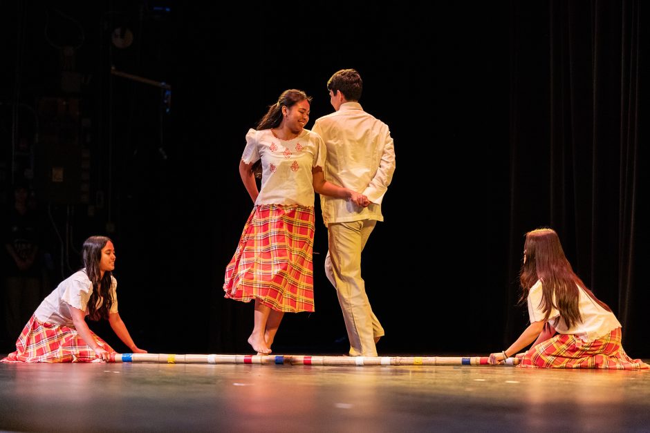Two people dance on stage
