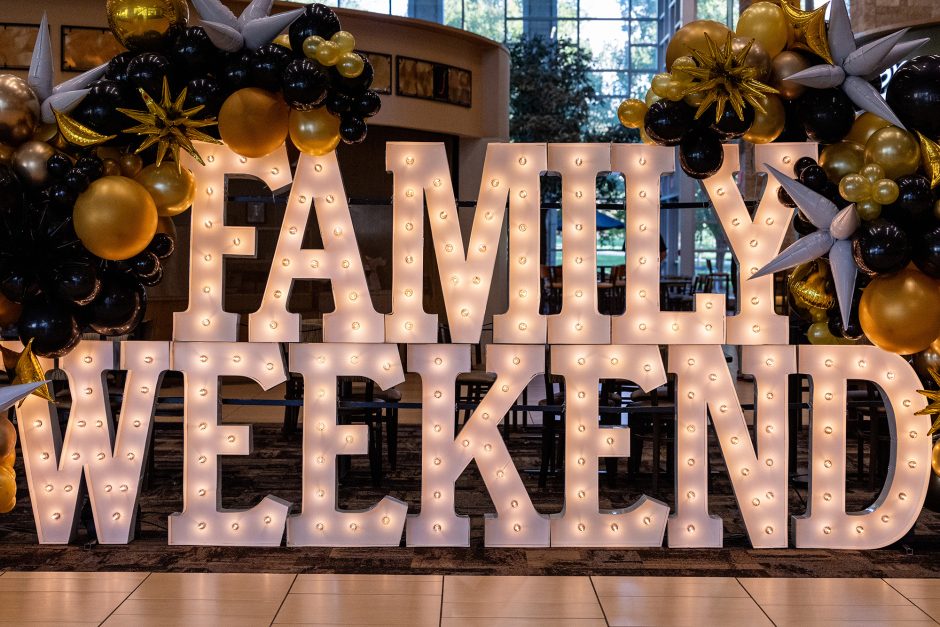 Lighted sign that says "Family Weekend"
