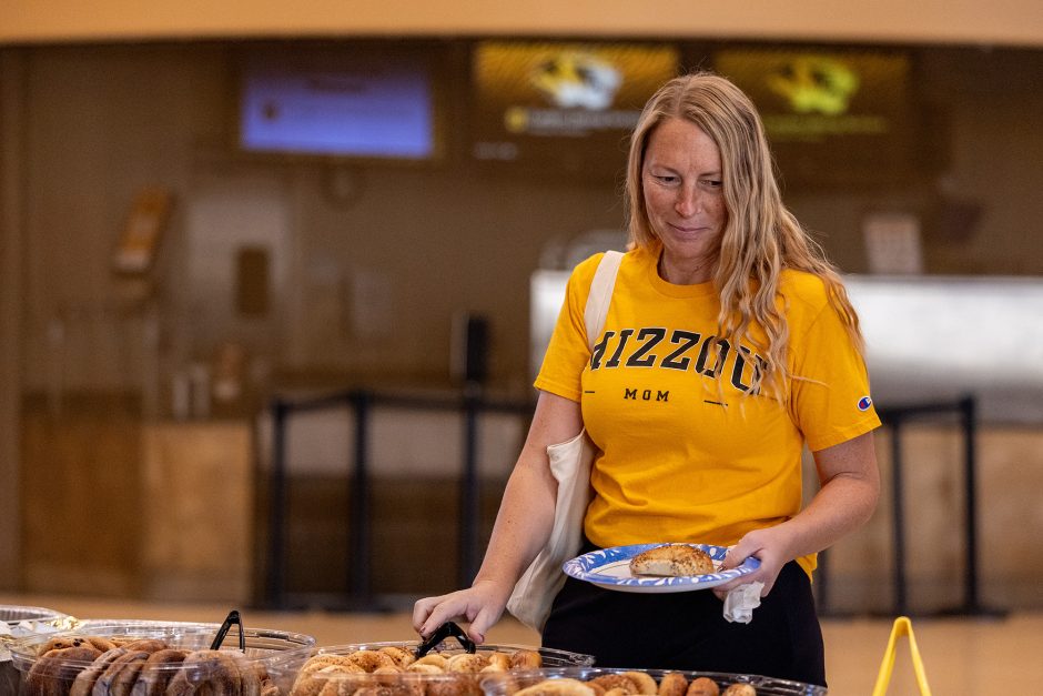 Person wearing Mizzou gear getting breakfast