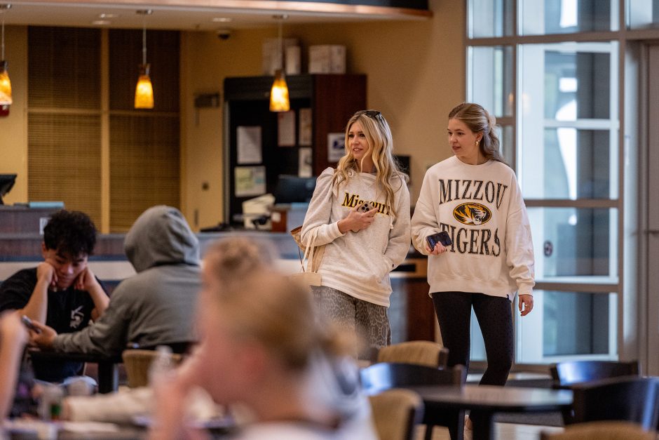 Two people wearing Mizzou shirts